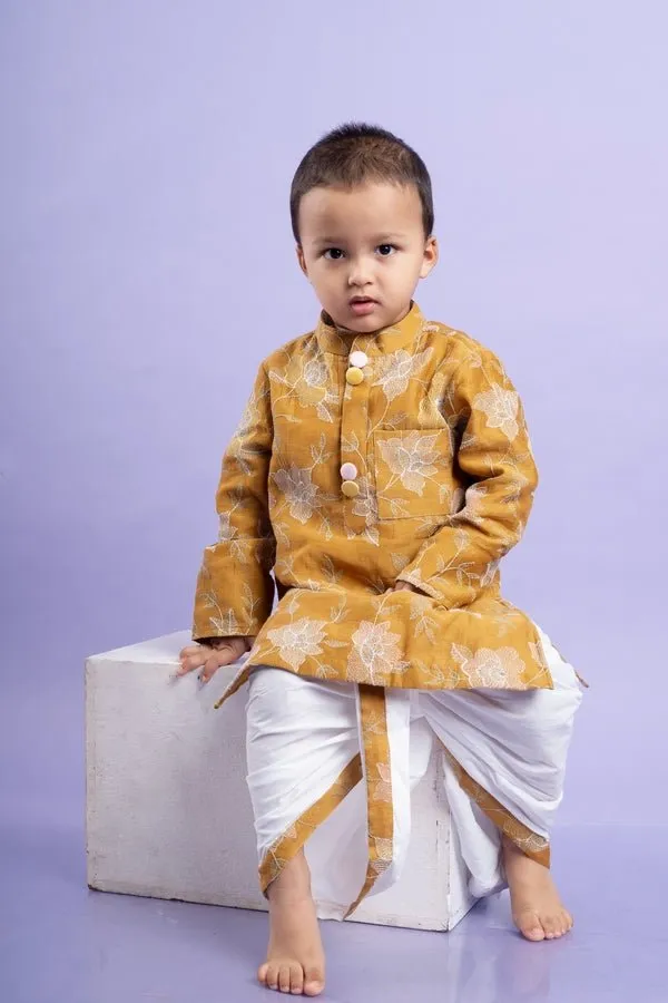 Mustard yellow embroidered kurta paired with classic white dhoti pants, perfect for festive celebrations